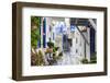 Narrow street, whitewashed buildings with blue paint work, flowers, Mykonos Town (Chora), Mykonos,-Eleanor Scriven-Framed Photographic Print