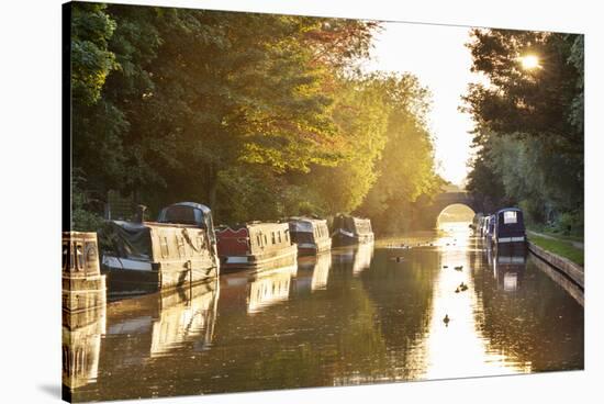 Narrowboats moored on the Kennet and Avon Canal at sunset, Kintbury, Berkshire, England-Stuart Black-Stretched Canvas