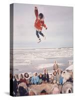 Native Alaskans Playing a Game of Nulukatuk, in Which Individals are Tossed into the Air-Ralph Crane-Stretched Canvas