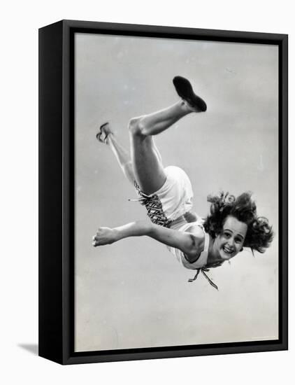 Natl. Women's Tumbling Champion, 15 Year Old, Bonnie Nebelong, in Mid Air with Legs Akimbo-Gjon Mili-Framed Stretched Canvas