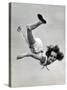 Natl. Women's Tumbling Champion, 15 Year Old, Bonnie Nebelong, in Mid Air with Legs Akimbo-Gjon Mili-Stretched Canvas