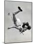 Natl. Women's Tumbling Champion, 15 Year Old, Bonnie Nebelong, in Mid Air with Legs Akimbo-Gjon Mili-Mounted Photographic Print