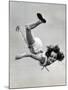 Natl. Women's Tumbling Champion, 15 Year Old, Bonnie Nebelong, in Mid Air with Legs Akimbo-Gjon Mili-Mounted Photographic Print