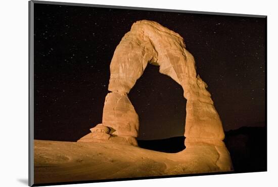 Natural sandstone arch in desert, at night with starry sky, Delicate Arch, Arches-Bob Gibbons-Mounted Photographic Print