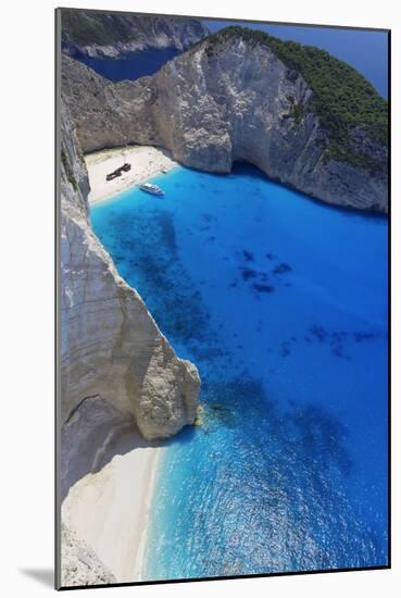 Navagio Beach and Shipwreck at Smugglers Cove on the Coast of Zakynthos-Sakis Papadopoulos-Mounted Photographic Print