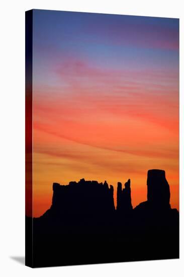 Navajo Nation, Monument Valley, Sunrise over Mitten Rock Formations-David Wall-Stretched Canvas