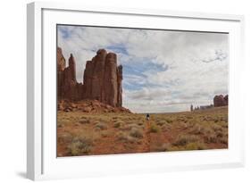 Navajo Person Rides a Horse Between Rock Formations-Eleanor Scriven-Framed Photographic Print