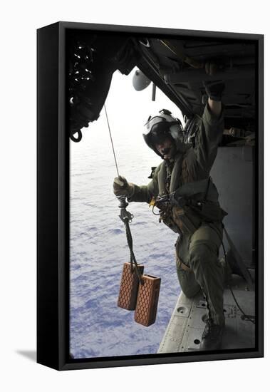 Naval Aircrewman Conducts a Search and Rescue Drill on an Mh-60S Sea Hawk-null-Framed Stretched Canvas
