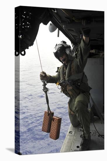 Naval Aircrewman Conducts a Search and Rescue Drill on an Mh-60S Sea Hawk-null-Stretched Canvas
