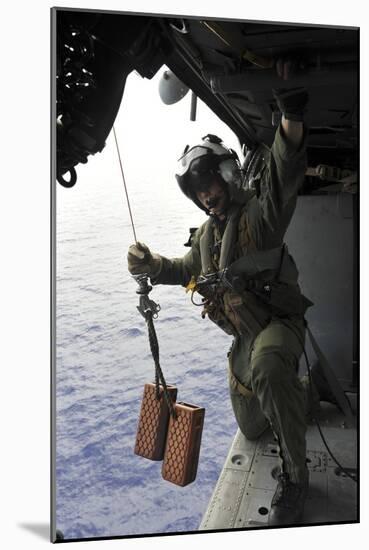 Naval Aircrewman Conducts a Search and Rescue Drill on an Mh-60S Sea Hawk-null-Mounted Photographic Print