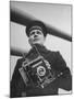 Navy Soldier Holding Camera-George Strock-Mounted Photographic Print