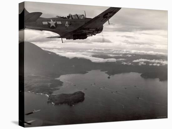 Navy Warplane Soaring over Tanahmerah Bay as Landing Craft Streaks For Beach Far Below-null-Stretched Canvas