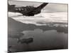 Navy Warplane Soaring over Tanahmerah Bay as Landing Craft Streaks For Beach Far Below-null-Mounted Photographic Print