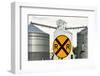 Nebraska, Blair, Washington County. Grain silo and equipment on Front Street, RR crossing sign.-Alison Jones-Framed Photographic Print