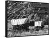 Nebraska, Scotts Bluff National Monument. Covered Wagons in Field-Dennis Flaherty-Framed Stretched Canvas