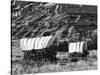 Nebraska, Scotts Bluff National Monument. Covered Wagons in Field-Dennis Flaherty-Stretched Canvas