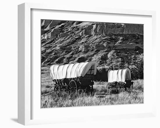 Nebraska, Scotts Bluff National Monument. Covered Wagons in Field-Dennis Flaherty-Framed Photographic Print