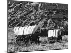 Nebraska, Scotts Bluff National Monument. Covered Wagons in Field-Dennis Flaherty-Mounted Photographic Print