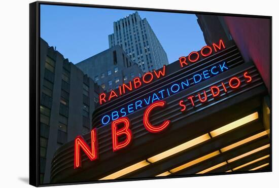 Neon lights of NBC Studios and Rainbow Room at Rockefeller Center, New York City, New York-null-Framed Stretched Canvas