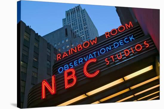 Neon lights of NBC Studios and Rainbow Room at Rockefeller Center, New York City, New York-null-Stretched Canvas