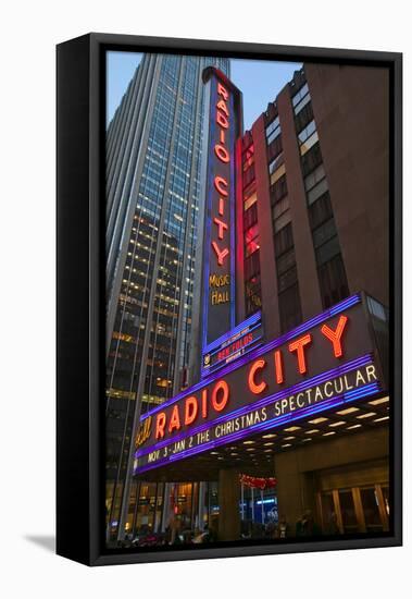 Neon lights of Radio City Music Hall at Rockefeller Center, New York City, New York-null-Framed Stretched Canvas