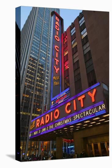 Neon lights of Radio City Music Hall at Rockefeller Center, New York City, New York-null-Stretched Canvas