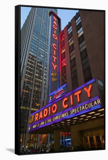 Neon lights of Radio City Music Hall at Rockefeller Center, New York City, New York-null-Framed Stretched Canvas