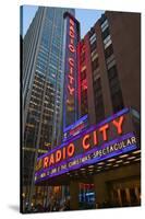 Neon lights of Radio City Music Hall at Rockefeller Center, New York City, New York-null-Stretched Canvas