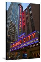 Neon lights of Radio City Music Hall at Rockefeller Center, New York City, New York-null-Stretched Canvas