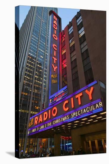 Neon lights of Radio City Music Hall at Rockefeller Center, New York City, New York-null-Stretched Canvas