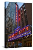 Neon lights of Radio City Music Hall at Rockefeller Center, New York City, New York-null-Stretched Canvas