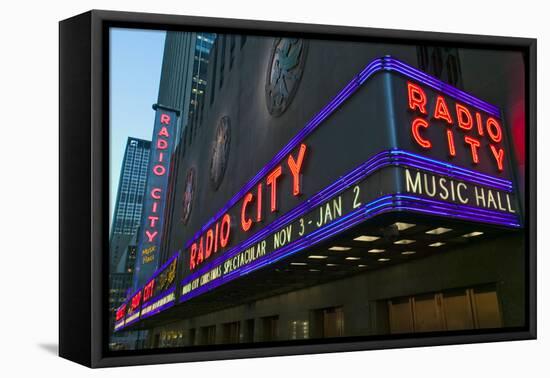 Neon lights of Radio City Music Hall at Rockefeller Center, New York City, New York-null-Framed Stretched Canvas