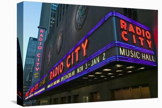 Neon lights of Radio City Music Hall at Rockefeller Center, New York City, New York-null-Stretched Canvas