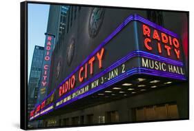 Neon lights of Radio City Music Hall at Rockefeller Center, New York City, New York-null-Framed Stretched Canvas