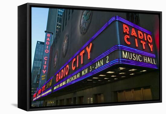 Neon lights of Radio City Music Hall at Rockefeller Center, New York City, New York-null-Framed Stretched Canvas