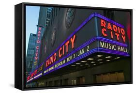 Neon lights of Radio City Music Hall at Rockefeller Center, New York City, New York-null-Framed Stretched Canvas