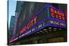 Neon lights of Radio City Music Hall at Rockefeller Center, New York City, New York-null-Stretched Canvas