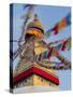 Nepal, Kathmandu, Swayambhunath Stupa and fluttering prayer flags in motion-Merrill Images-Stretched Canvas