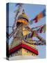 Nepal, Kathmandu, Swayambhunath Stupa and fluttering prayer flags in motion-Merrill Images-Stretched Canvas