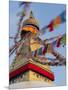 Nepal, Kathmandu, Swayambhunath Stupa and fluttering prayer flags in motion-Merrill Images-Mounted Photographic Print