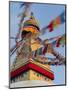 Nepal, Kathmandu, Swayambhunath Stupa and fluttering prayer flags in motion-Merrill Images-Mounted Photographic Print