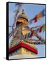 Nepal, Kathmandu, Swayambhunath Stupa and fluttering prayer flags in motion-Merrill Images-Framed Stretched Canvas