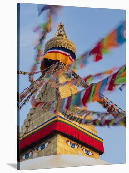 Nepal, Kathmandu, Swayambhunath Stupa and fluttering prayer flags in motion-Merrill Images-Stretched Canvas