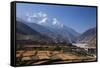 Nepal, Mustang, Kagbeni. the Soaring Peak of Nilgiri Behind the Village of Kagbeni.-Katie Garrod-Framed Stretched Canvas