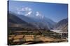 Nepal, Mustang, Kagbeni. the Soaring Peak of Nilgiri Behind the Village of Kagbeni.-Katie Garrod-Stretched Canvas