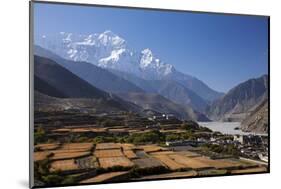 Nepal, Mustang, Kagbeni. the Soaring Peak of Nilgiri Behind the Village of Kagbeni.-Katie Garrod-Mounted Photographic Print