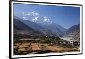 Nepal, Mustang, Kagbeni. the Soaring Peak of Nilgiri Behind the Village of Kagbeni.-Katie Garrod-Framed Premium Photographic Print