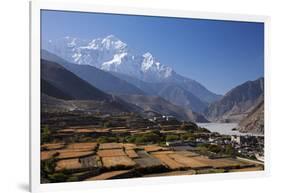 Nepal, Mustang, Kagbeni. the Soaring Peak of Nilgiri Behind the Village of Kagbeni.-Katie Garrod-Framed Photographic Print