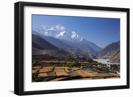 Nepal, Mustang, Kagbeni. the Soaring Peak of Nilgiri Behind the Village of Kagbeni.-Katie Garrod-Framed Photographic Print