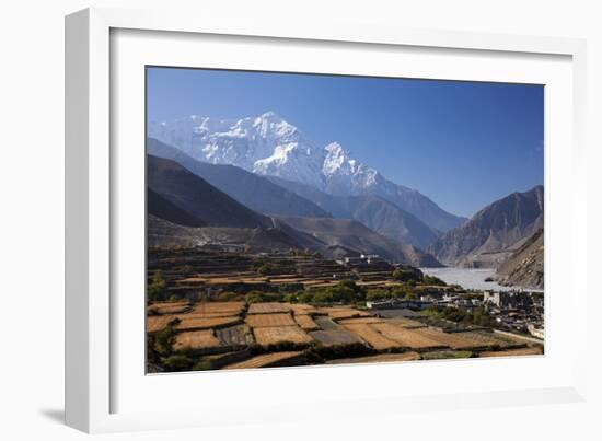 Nepal, Mustang, Kagbeni. the Soaring Peak of Nilgiri Behind the Village of Kagbeni.-Katie Garrod-Framed Photographic Print